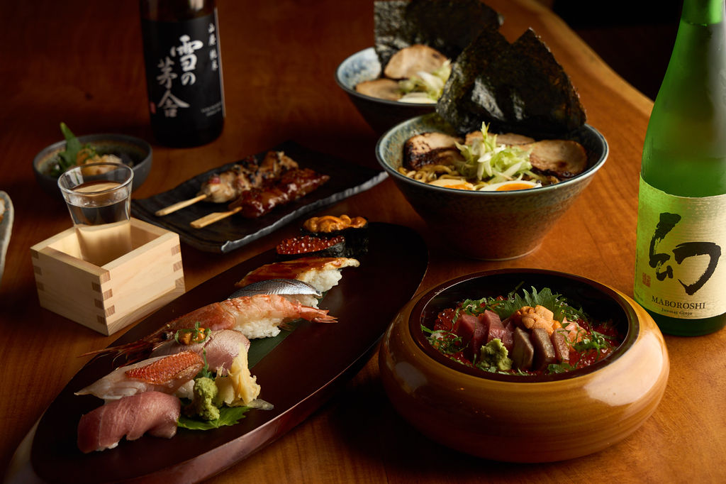 Anaba food spread — nigiri, ramen, yakitori and sake