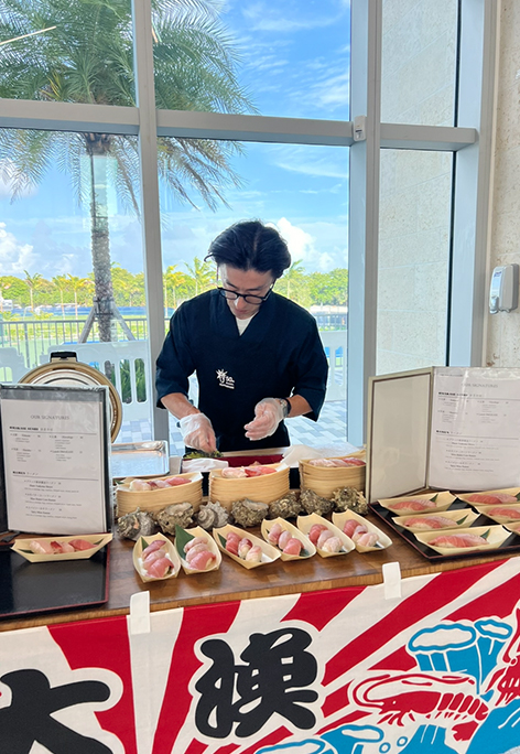 Anaba chef serving at an outdoor catering event in Miami